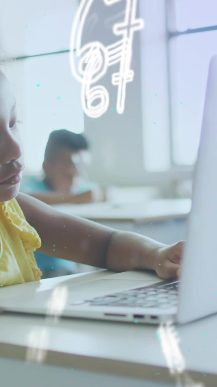 Animation of numbers moving over schoolgirl using laptop at desk in class