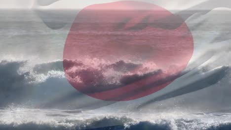 digital composition of japan flag waving against aerial view of waves in the sea