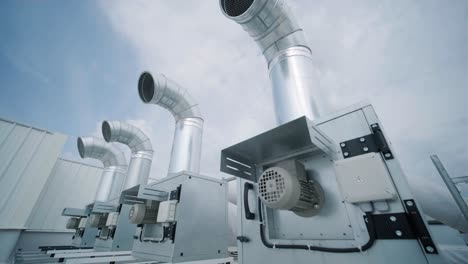 the air conditioning and ventilation system of a large industrial facility is located on the roof. it includes an air conditioner, smoke exhaust, and ventilation.