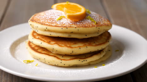 stack of pancakes with orange and lemon zest