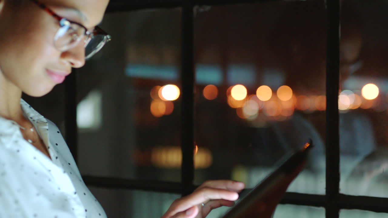 Black woman in business and thinking on tablet