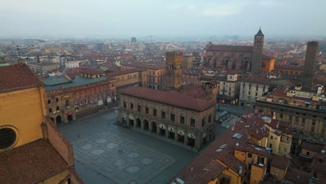 orbiting drone shot above piazza maggiore, bologna, italy
