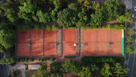 aerial view of tennis courts in a park