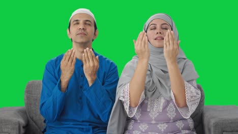 religious muslim couple reading namaz green screen