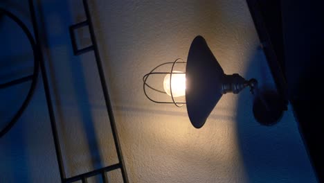 industrial style wall lamp illuminating a wall