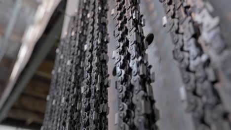 close up of chainsaw chains hanging in garage, steel chains in lumber industry