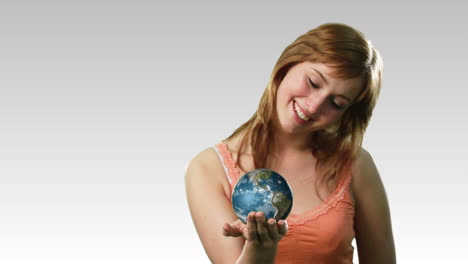 attractive lady holding the earth