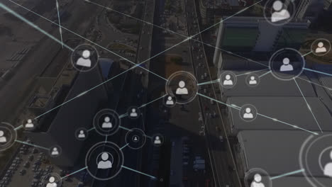 Animation-of-network-of-profile-icons-against-aerial-view-of-cityscape