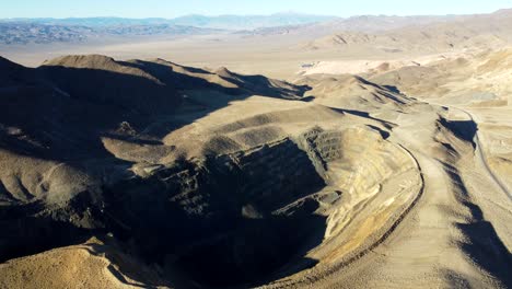 us, nv, luning, hwy 316, 2025-01-17 - drone view of an abandoned open pit mine at sunrise in the desert