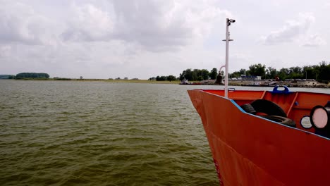 ferry boat approching bratianu docks after crossing the danube river from galati, romania.