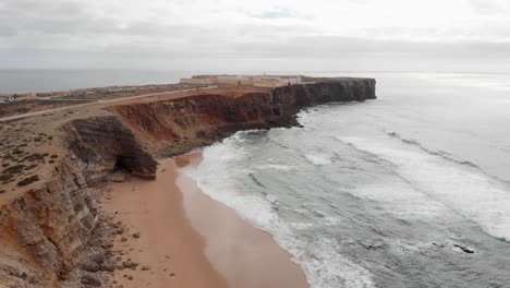 Drone-shot-of-Cape-Roca,-Portuguese-Cabo-Da-Roca,-also-called-Focinho-Da-Rosa,-promontory-in-Portugal,-and-the-western-most-point-of-continental-Europe