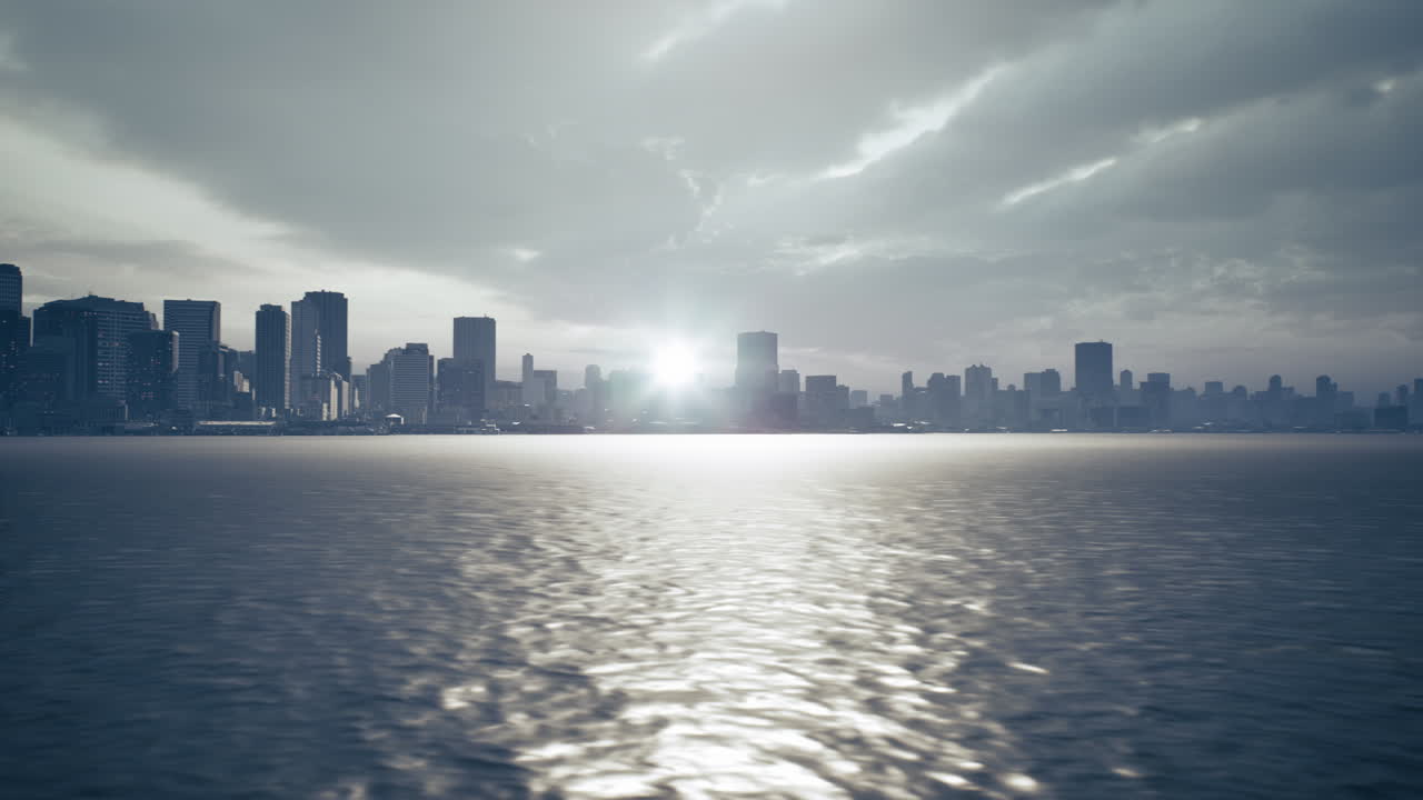 Sunset over a modern city skyline reflecting on a calm body of water