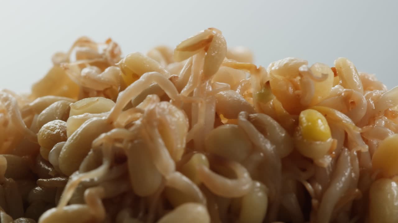 Salted soybean fermented in jar, chinese soy production, marinated food, germinated soy close up in cafe restaurant.