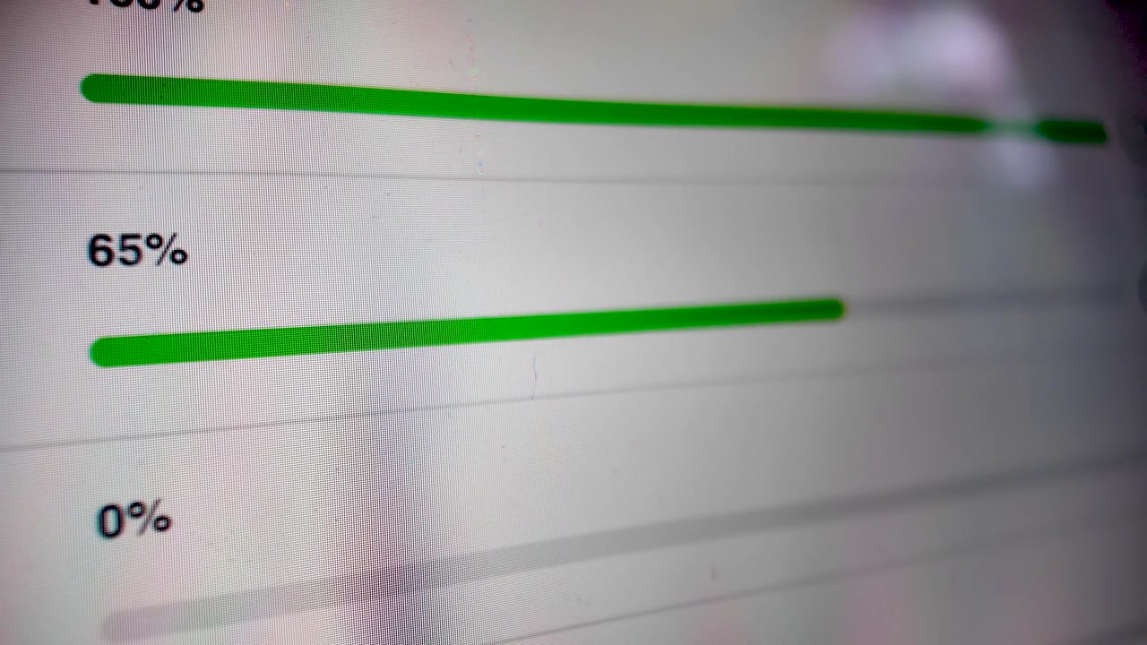 Digital file uploading or downloading with a green status bar showing the increasing percentage