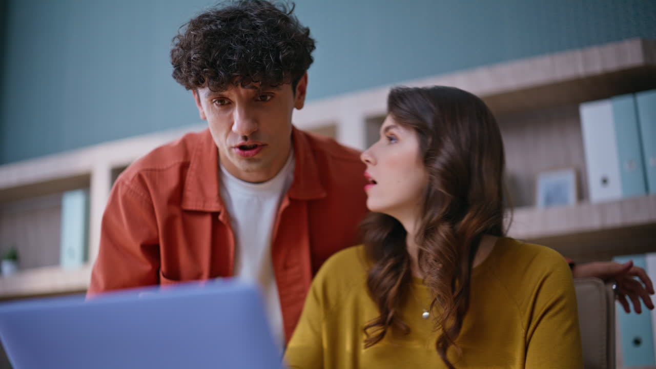 Two employees arguing virtual meeting by office laptop closeup. Nervous people