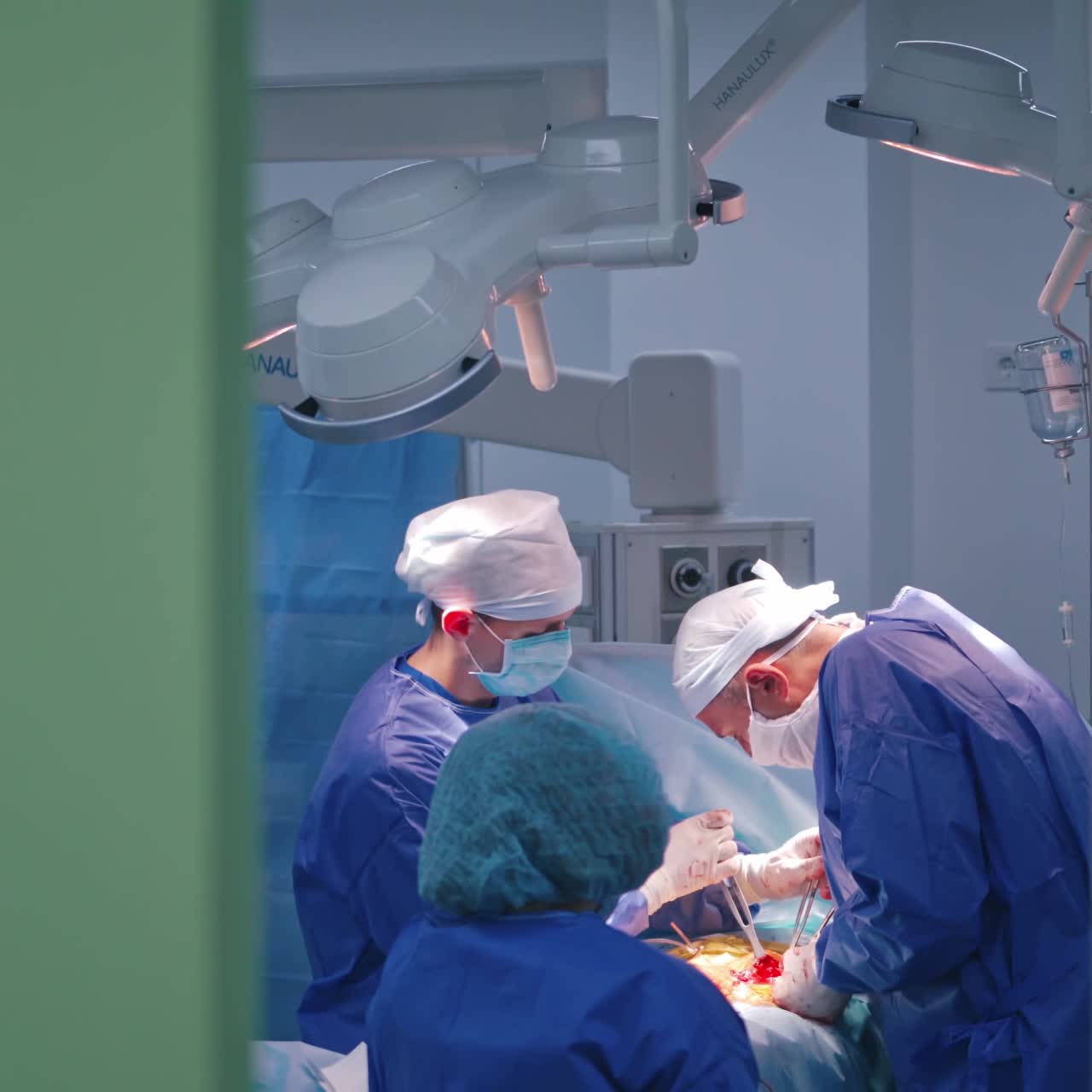 Surgeons group doing surgery