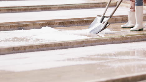 Workers-Shoveling-Salt-At-Rio-Maior-Salt-Farm-In-Portugal