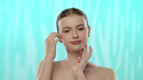 young woman with clear radiant face smiling gently for skincare a young woman with a clear complexion gently touches her face suggesting a skincare theme and youthful radiance