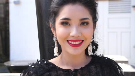 portrait of young asian woman smiling, slow motion