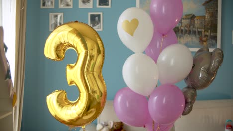 birthday balloons in bright room