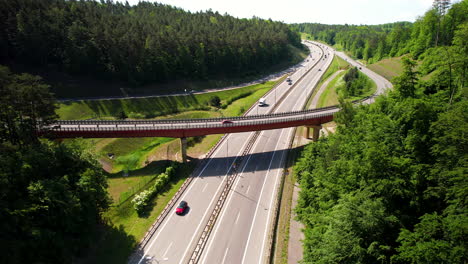 aerial view of cars traffic on countryside curved highway with bridge intersection