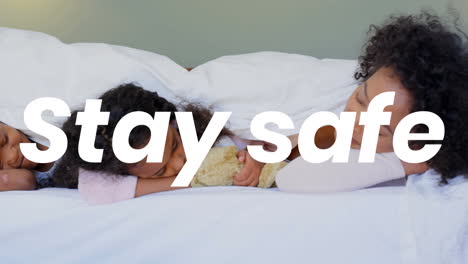 african woman and her daughter with words stay safe during coronavirus pandemic