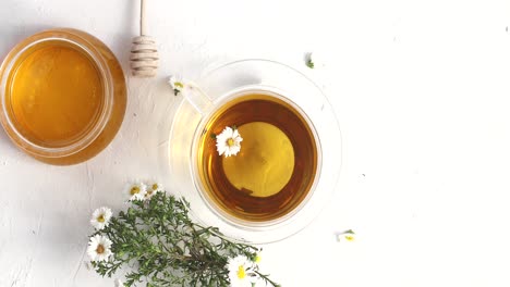 Cup-of-tea-and-bowl-of-honey