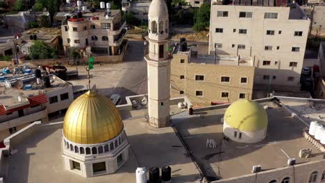 aerial view over golden dome mosque in palestine town biddu,near jerusalem