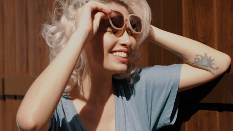 woman posing in sunglasses