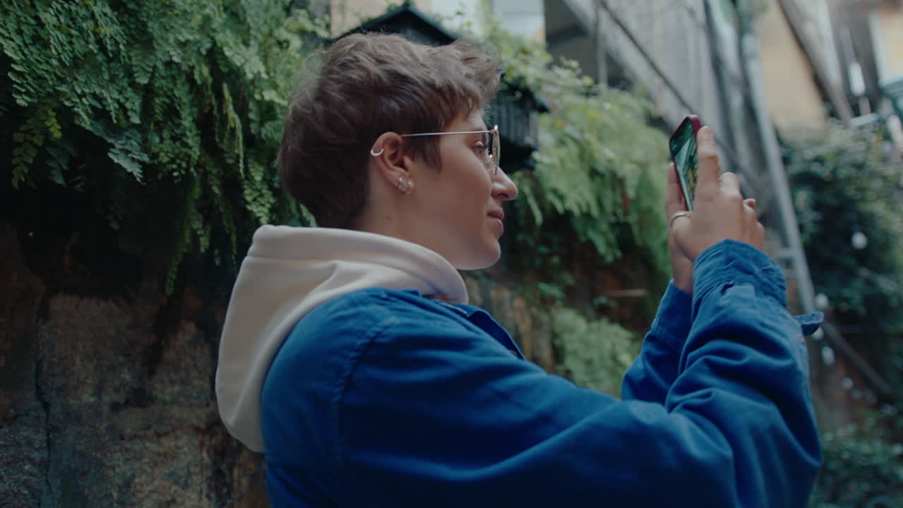 Girl Photographing Street in Old Town with Smartphone