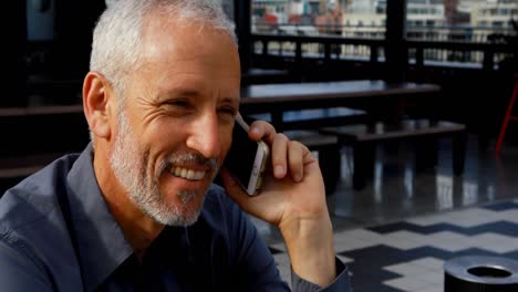 businessman talking on mobile phone in hotel 4k