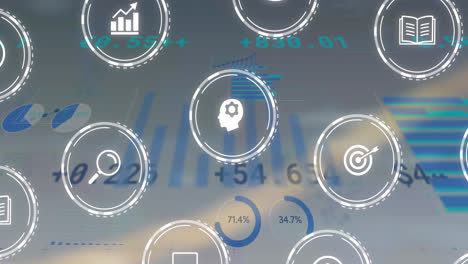 animation of multiple digital icons over statistical data processing against grey background