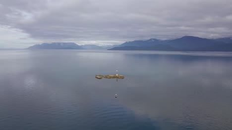 wide aerial vanderbilt reef with dive boat and mountains