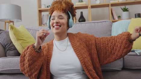 dancing, music headphones and happy woman in home