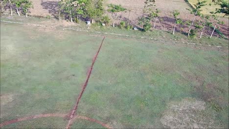 drone flight over football fields in rural blora, central java, indonesia