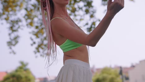 woman playing catch paddle in the park