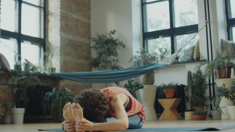 woman practicing yoga and stretching