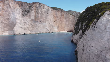 aerial view of zakynthos beach with the wreck, people and little boats