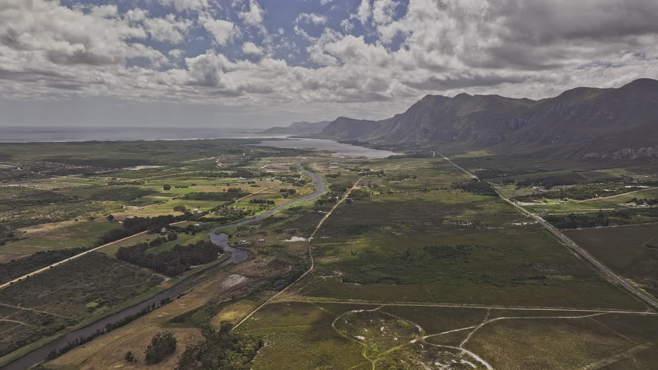 Aerial View of River Valley and Mountains