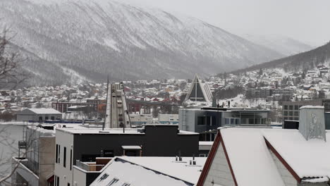 tromso bridge with traffic and arctic cathedral during winter season in tromso, norway