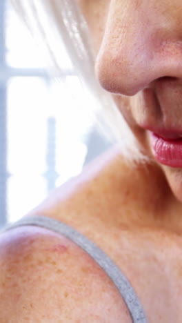 dermatologist examining mole with magnifying glass