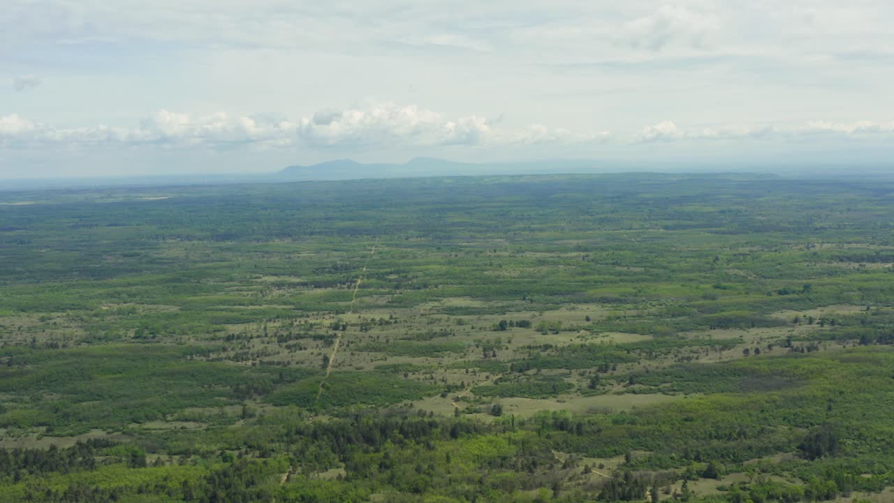 Vast Grassland On Foggy Weather In Deliblato Sands, Vojvodina Province, Serbia. aerial wide shot