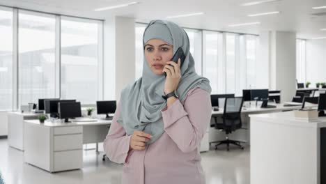 muslim businesswoman talking on phone