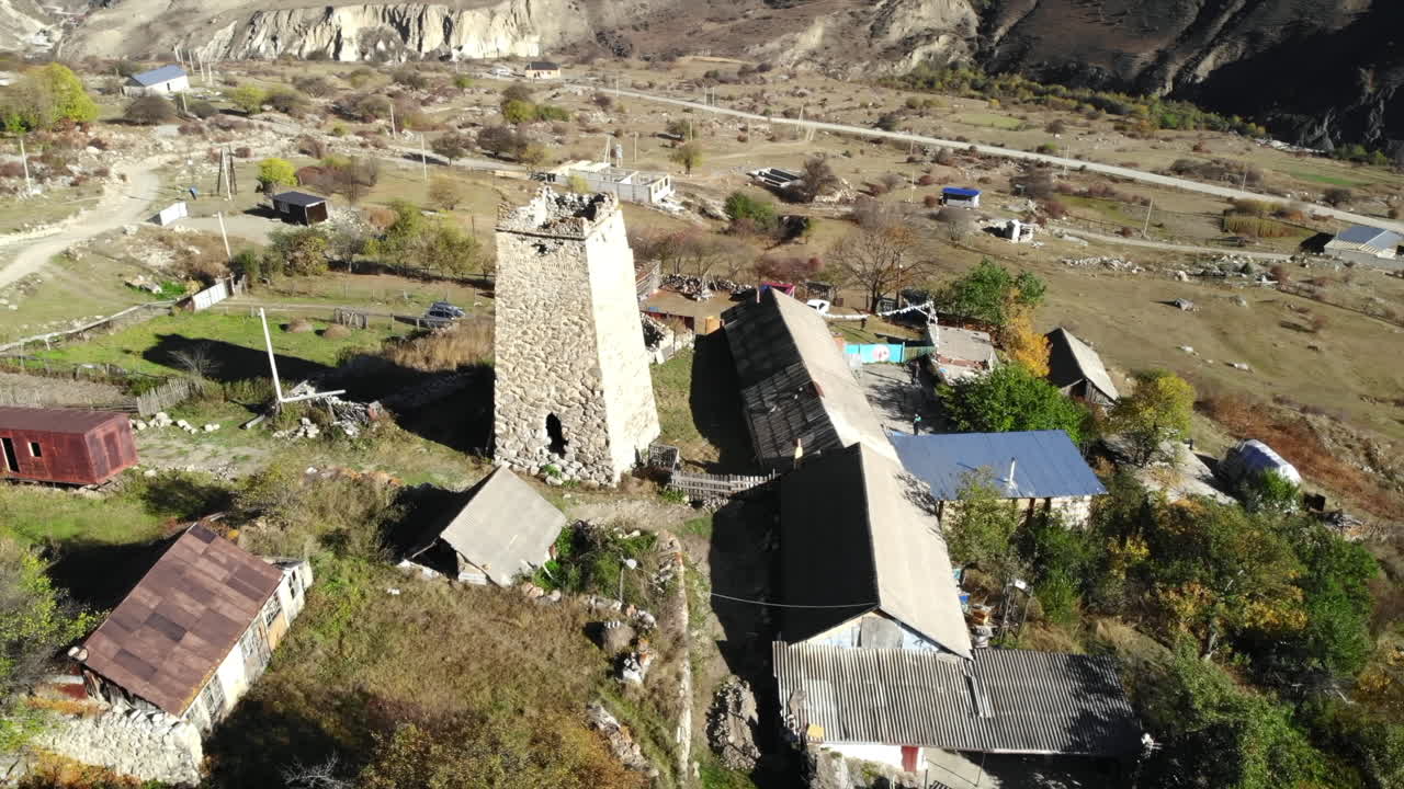 Picturesque Mountain Village with Ancient Stone Tower