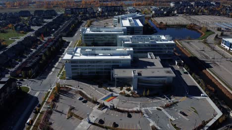 revealing drone shot of the office business center in quarry park in calgary