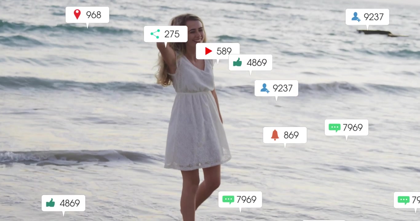 Content creator stepping in surf at dusk sparking floating social icons with rising follower counts