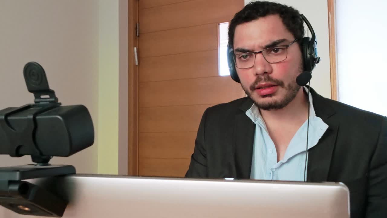 Analyzing Performance Data: Man with Tablet in Call