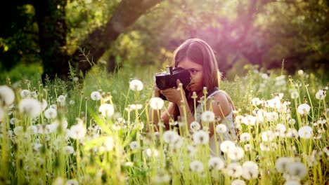 girl photographer of twelve years takes pictures of nature