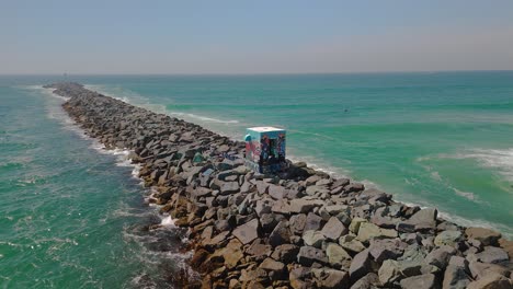 Aerial-View-Of-The-Graffiti-Shack-on-Mission-Beach-Jetty-In-San-Diego,-California,-USA