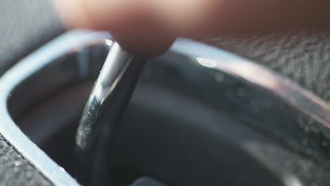 close up, shifting gears from park into drive in a vehicle